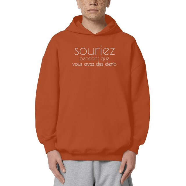Image front Sweat à capuche Unisexe Oversized - Souriez pendant que vous avez des dents