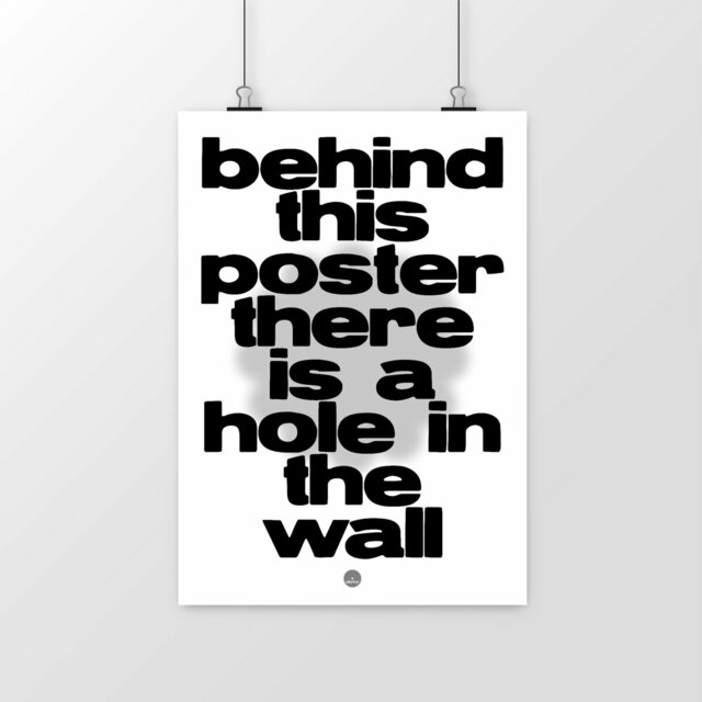 behind this poster there is a hole in the wall poster